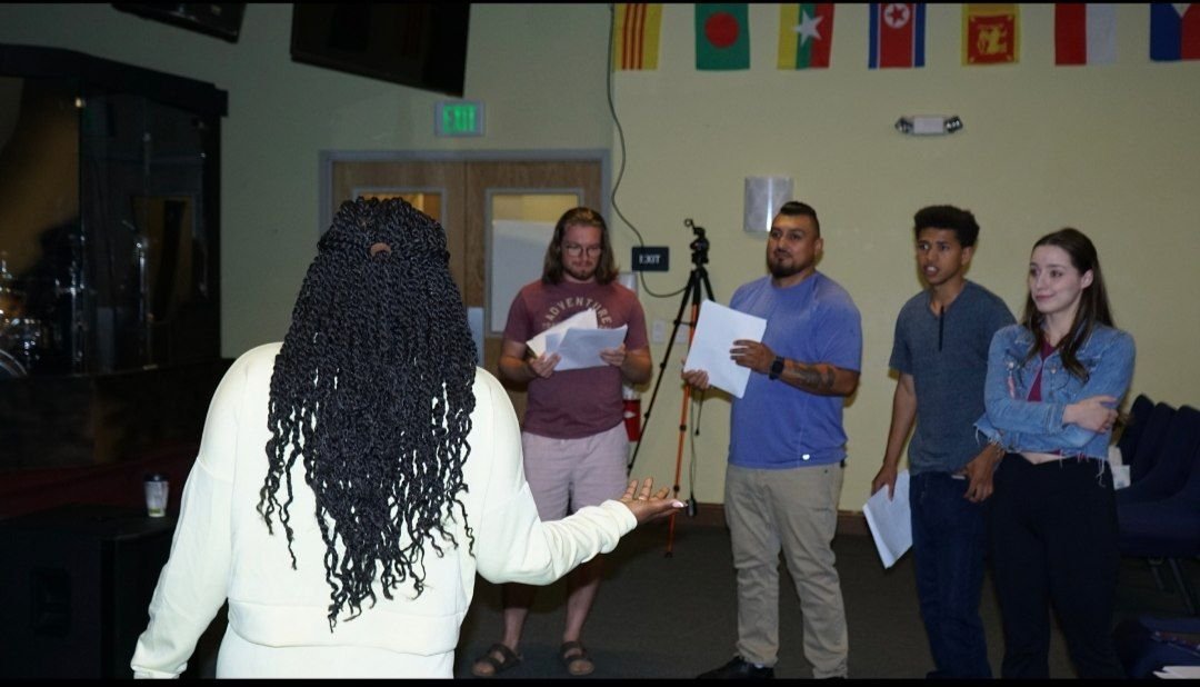 Reine working with cast members on the Between Two Lives set