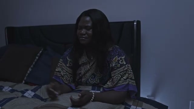 Nia emotional on her bed in the opening of Grace In Disguise