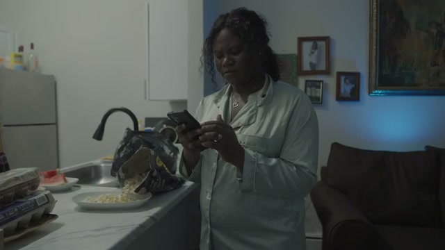 Nia in pajamas in her kitchen in Grace In Disguise